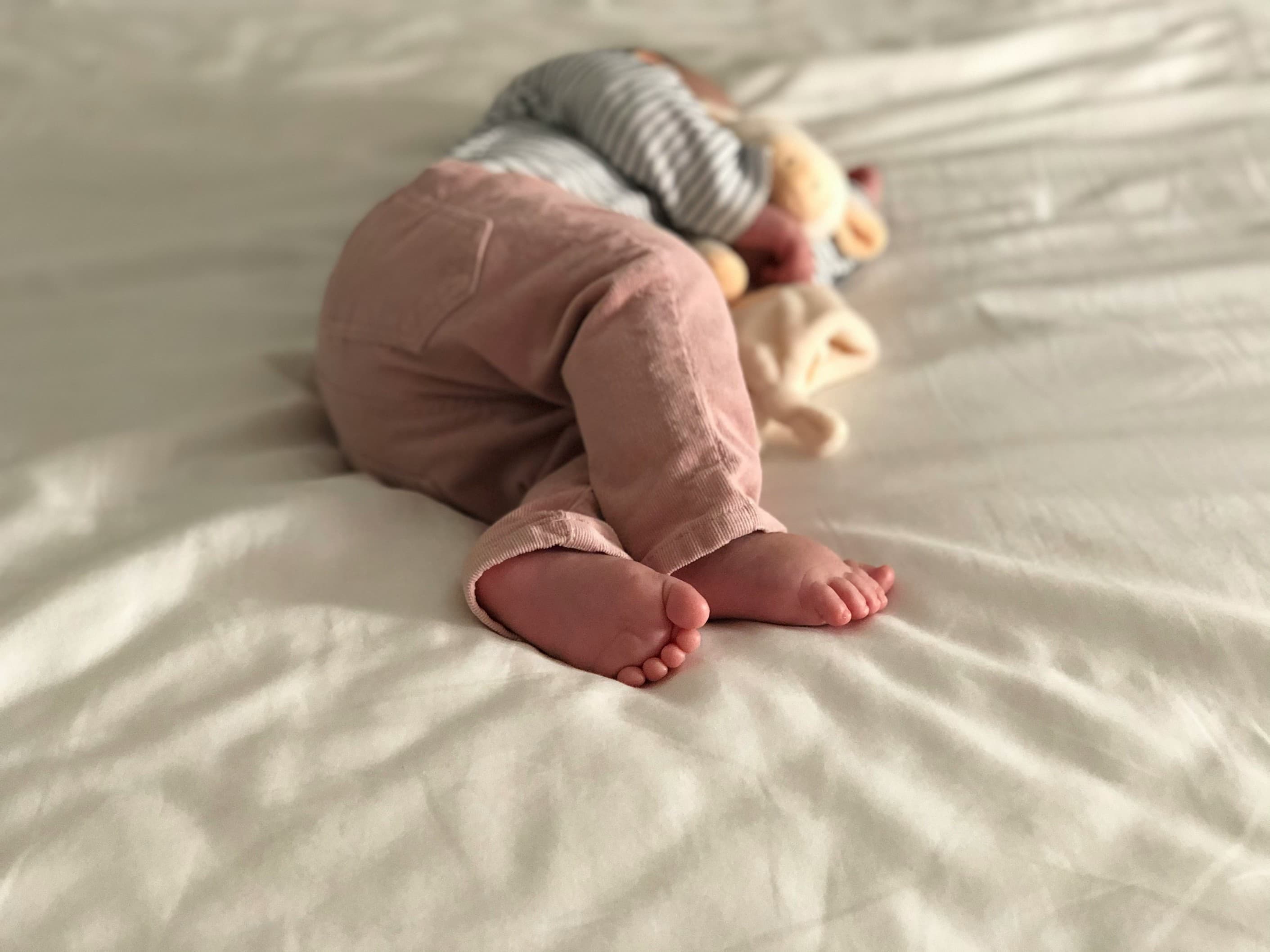 Why does a child tilt their head back while sleeping?